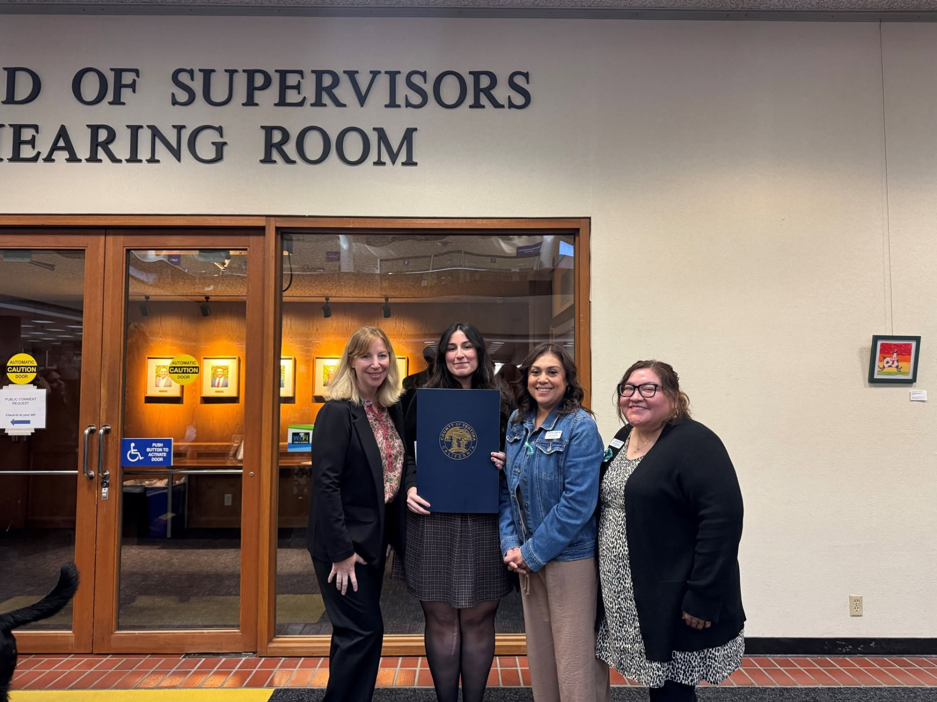 Coalition staff with a County of Ventura proclamation outside the Board of Supervisors hearing room
