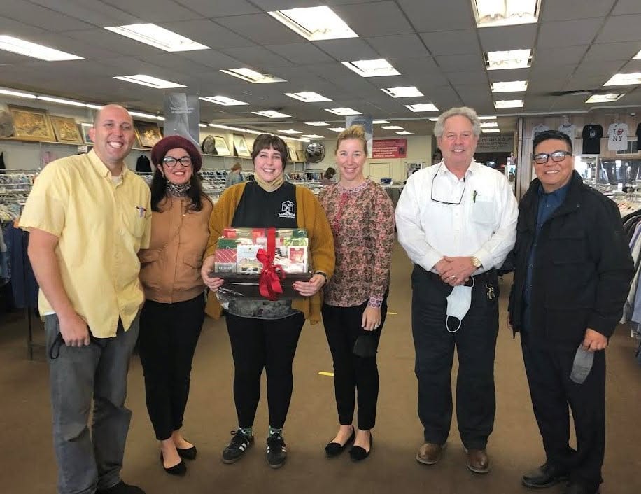 Community partners presenting a gift basket to Coalition staff